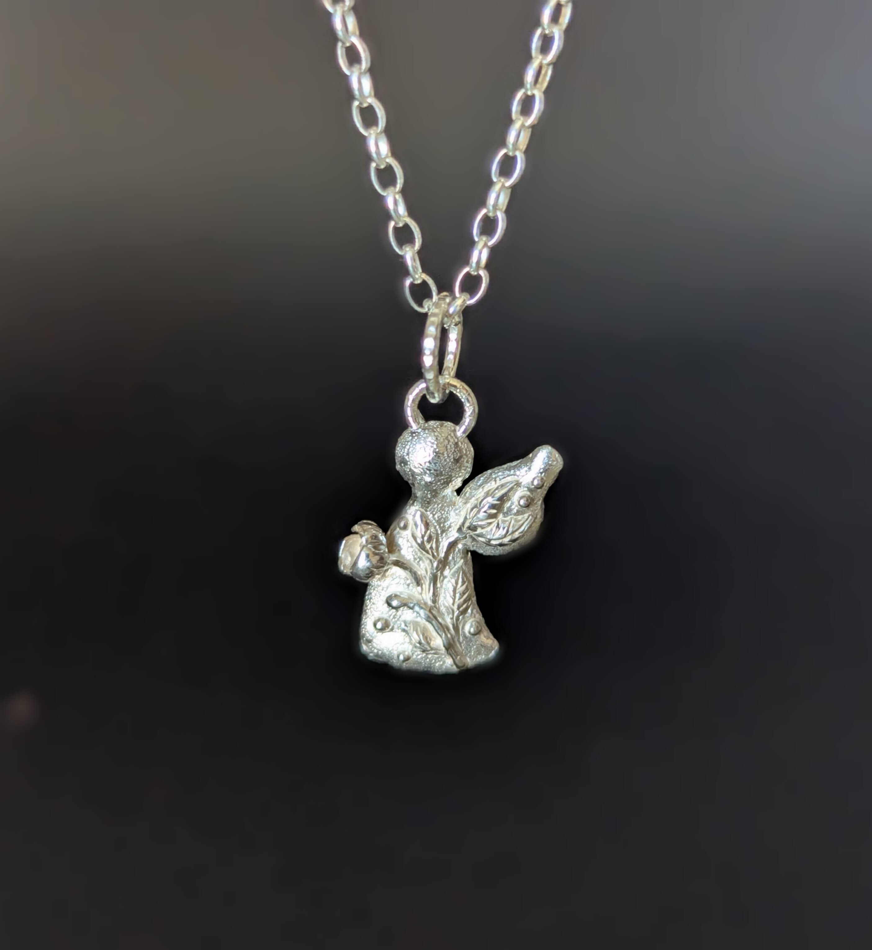 Pakabukas "Angelas su gėle". Išankstinis užsakymas